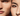 Close-up of two people's faces with a blurred background
