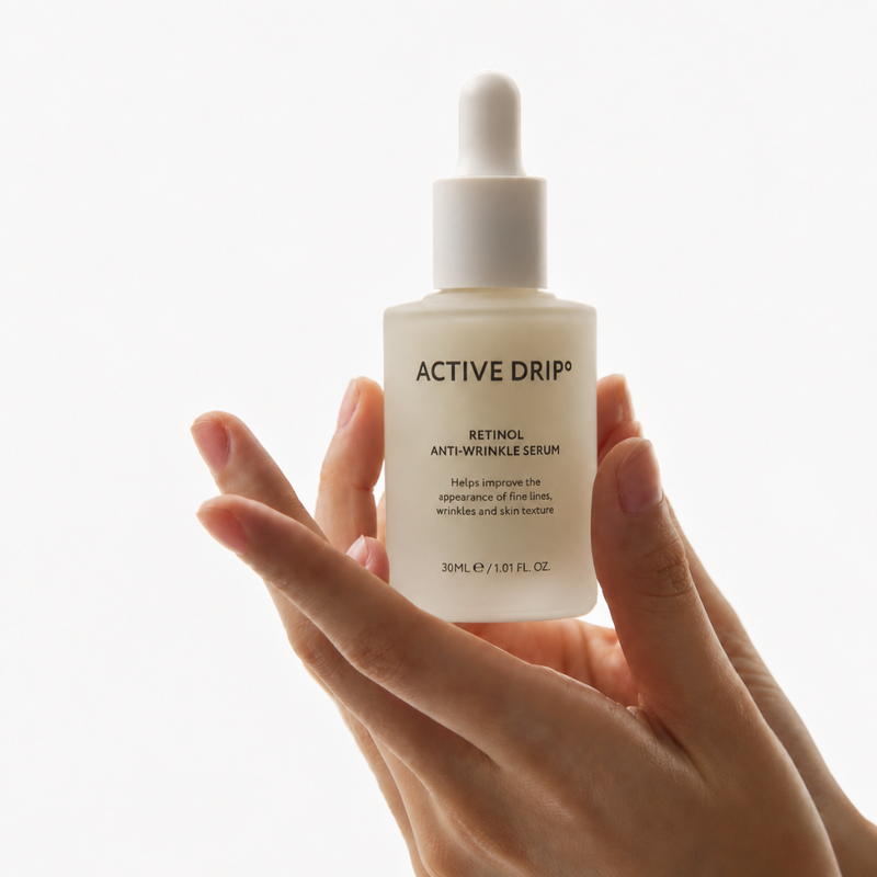 Hand holding Active Drip Retinol serum dropper, gentle Vitamin A formulation for sensitive skin